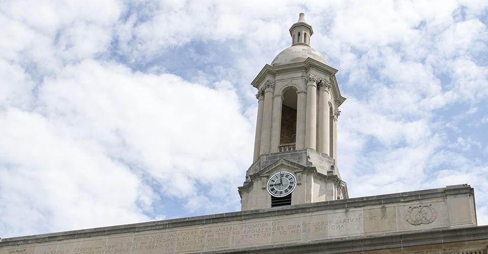 Old Main Bell Tower against Blue and White Sky